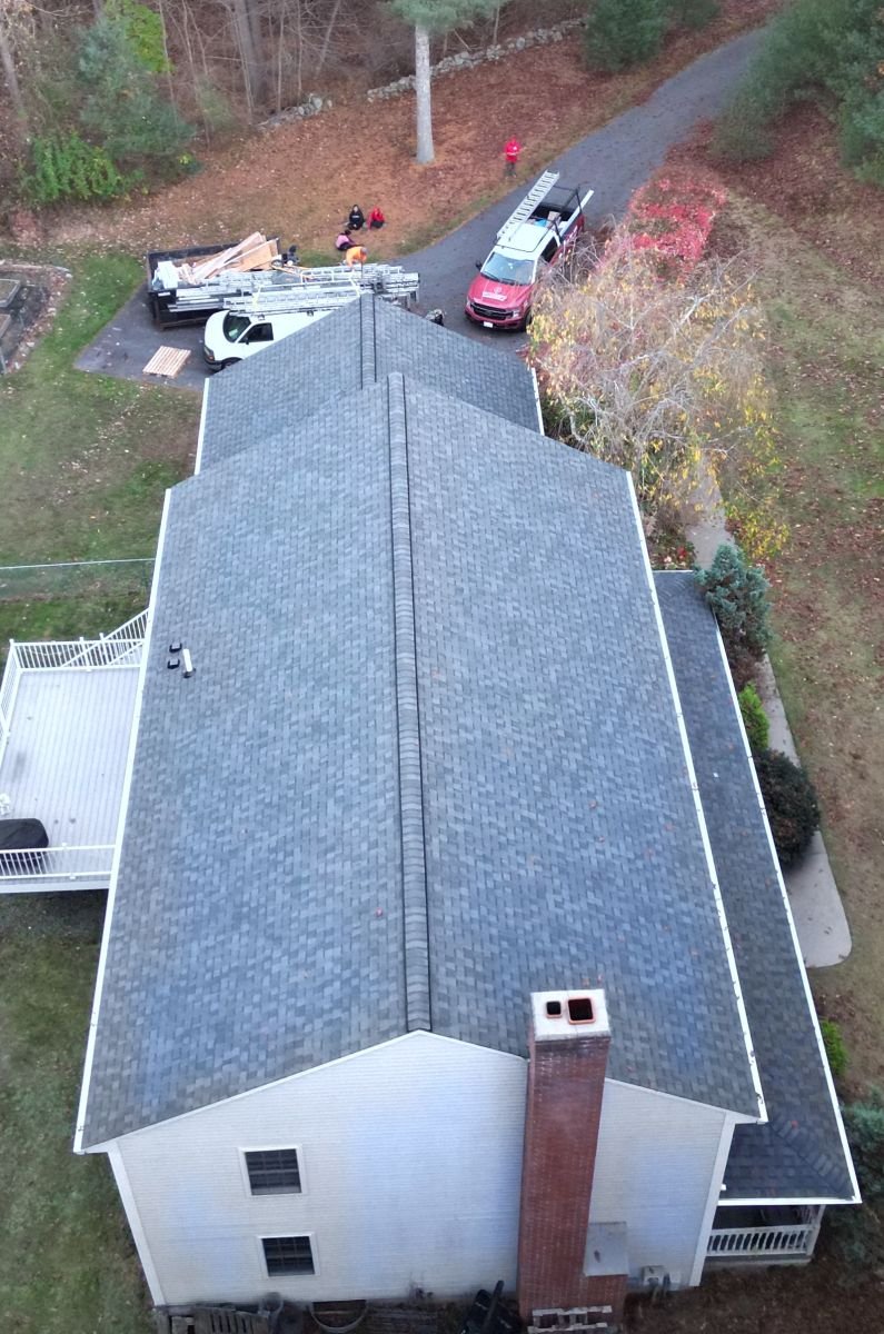Top-down drone view of a finished roof ridge